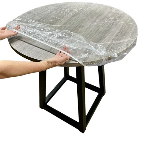 Large RoundElastic Edge Design Fits Easily Around Any Round Table Up To 45"-56" Diameter ; High Quality and Environmental Material Surface 100 Vinyl, Flannel Backing 100 Polyester Materials ; Elastic Design Elastic edges keep the pvc tablecloth tightly fitted and stay free from moving falling off. . Round elastic tablecloth